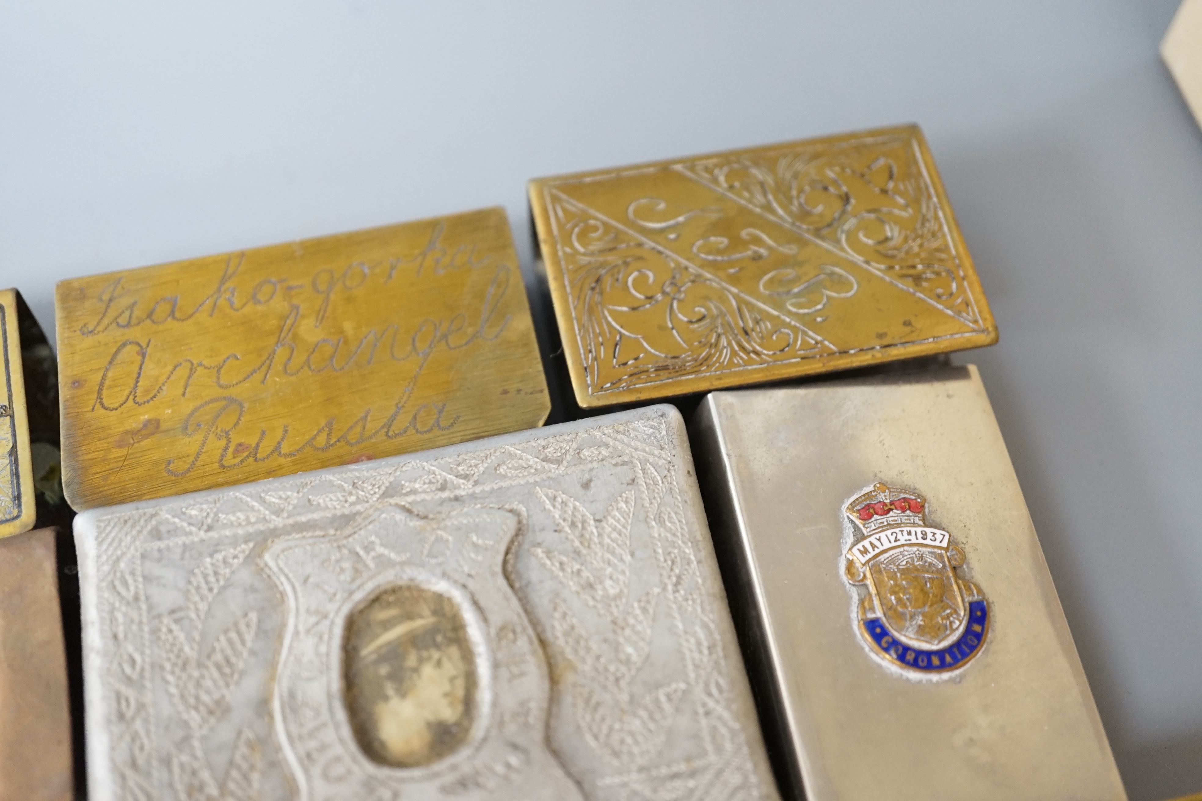 A collection of trench art and military vestas and matchbox holders